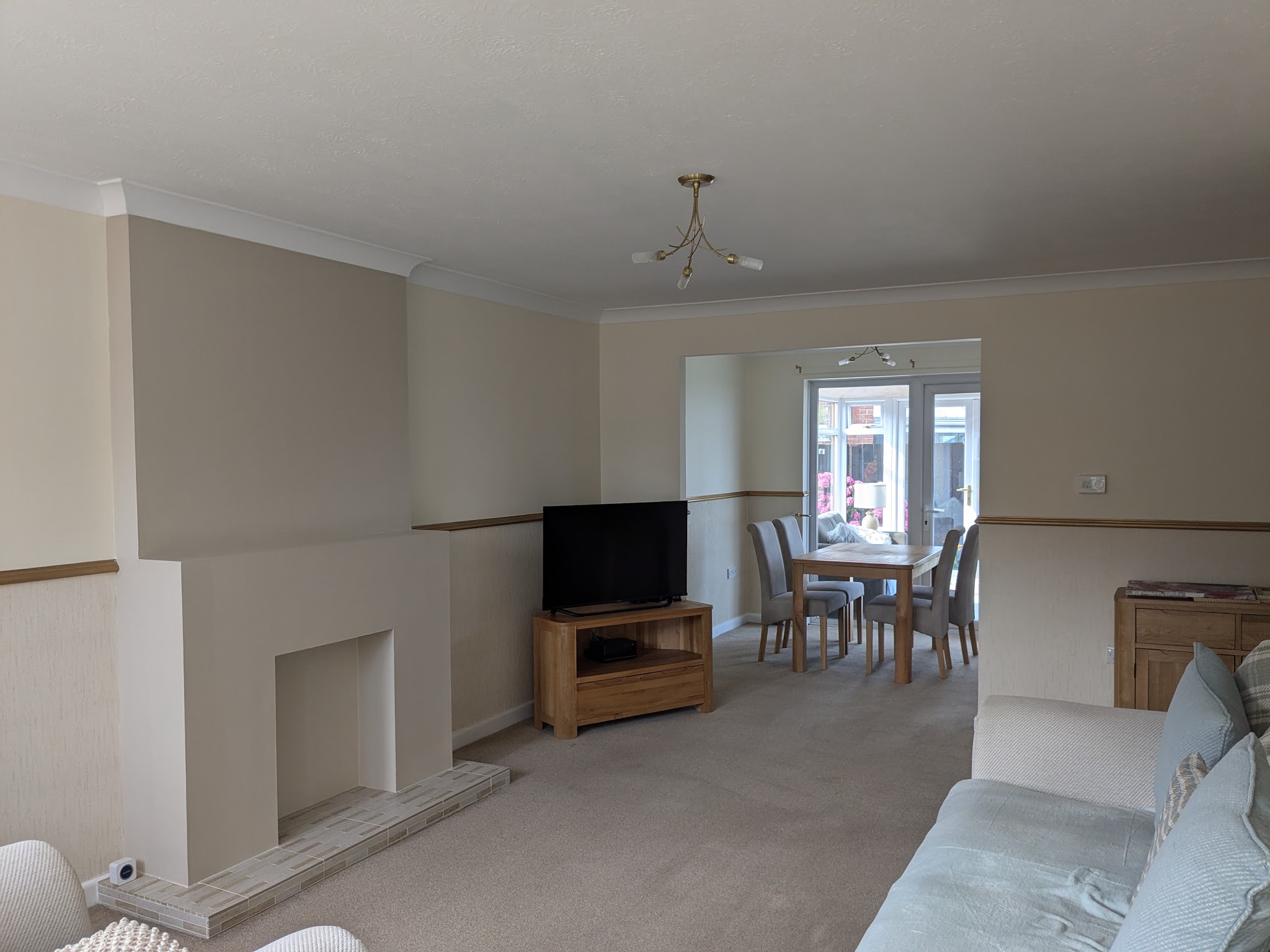 A decorated living room with a fireplace
